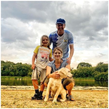 Andrea Lowe with her boyfriend, Terry Betts, her kid, and pet.